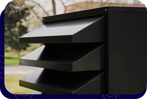 Close-up of the front of the black heat pump enclosure, highlighting its modern design.