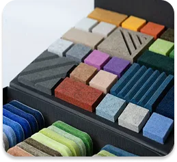 A sample book of acoustic materials, showing the variety of colors and textures available for your project.