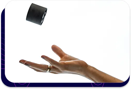 Photo showing a hand tossing a small, black s|TWIST acoustic attenuator.