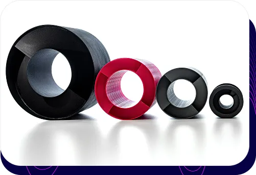Product photo showing four round sTWIST acoustic silencers in various sizes and colours. The silencers are manufactured using 3D printing technology.